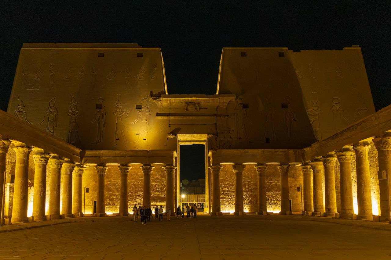 Nile cruise ship lit up at night in Luxor
