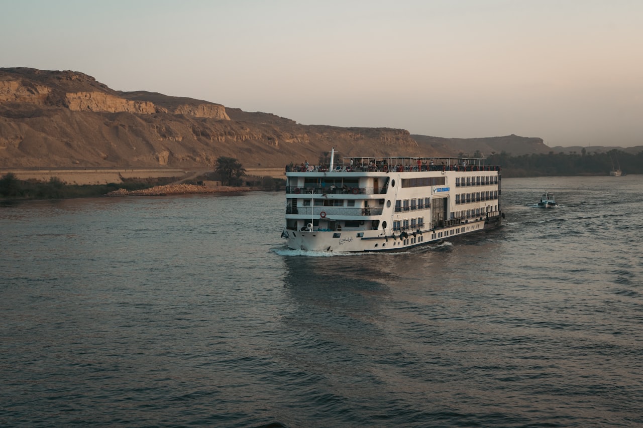 Nile cruise ship sailing at sunset